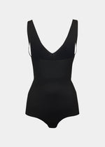 Still product image of Maxi Sexy Bodybriefer in black on a grey background. Smooth powerful fabric providing firm control for tummy, waist, and back, with seamless edges, cotton gusset, and hook-and-eye closure at the bottom visible.