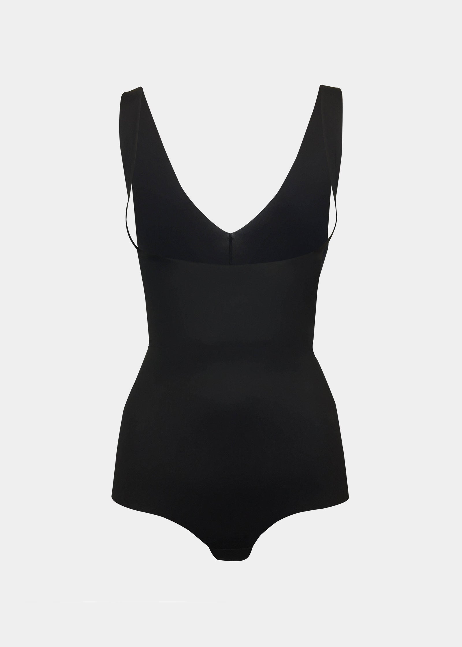 Still product image of Maxi Sexy Bodybriefer in black on a grey background. Smooth powerful fabric providing firm control for tummy, waist, and back, with seamless edges, cotton gusset, and hook-and-eye closure at the bottom visible.