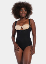 Front view of a model wearing Maxi Sexy Bodybriefer in black, wearable with your own bra. Smooth powerful fabric providing firm control for tummy, waist, and back, with seamless edges, cotton gusset, and hook-and-eye closure at the bottom visible.