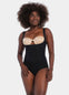 Front view of a model wearing Maxi Sexy Bodybriefer in black, wearable with your own bra. Smooth powerful fabric providing firm control for tummy, waist, and back, with seamless edges, cotton gusset, and hook-and-eye closure at the bottom visible.