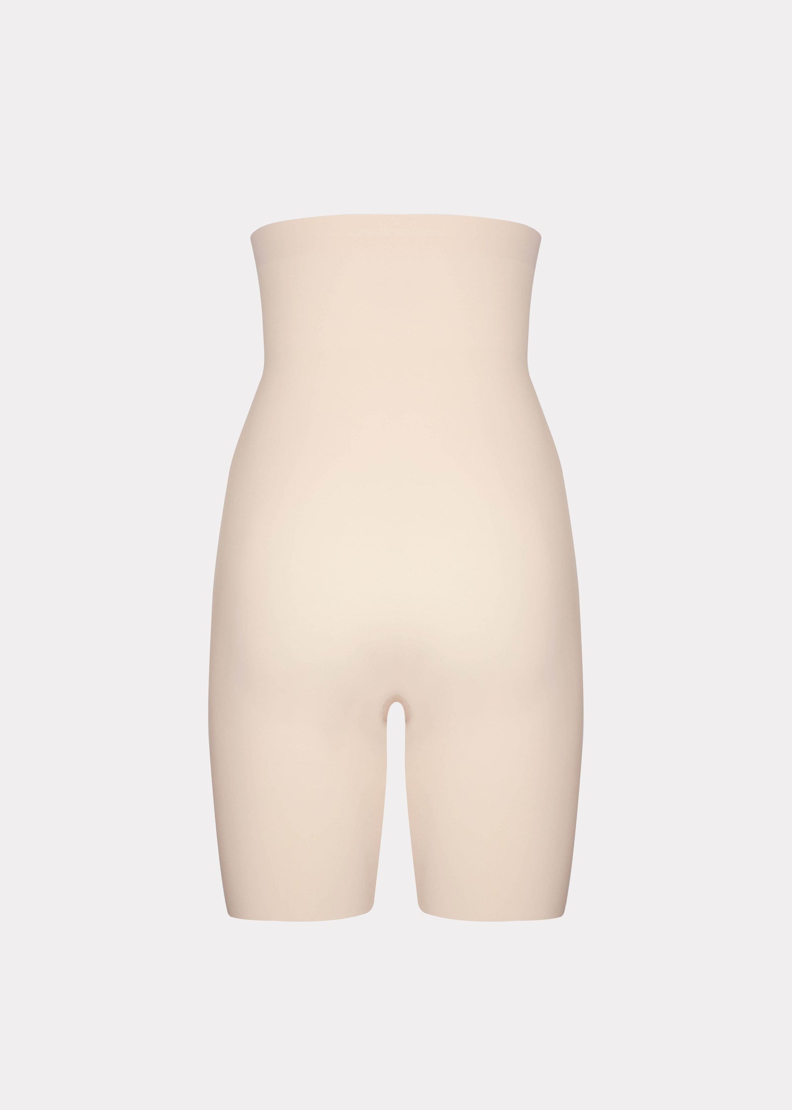 Still product image of Maxi Sexy Hi-Bermuda in latte shown from the back. High-waist mid-thigh shaping shorts with smooth powerful fabric, firm control for lower back, hips, and thighs, seamless edges, and silicone-trimmed waistband visible.