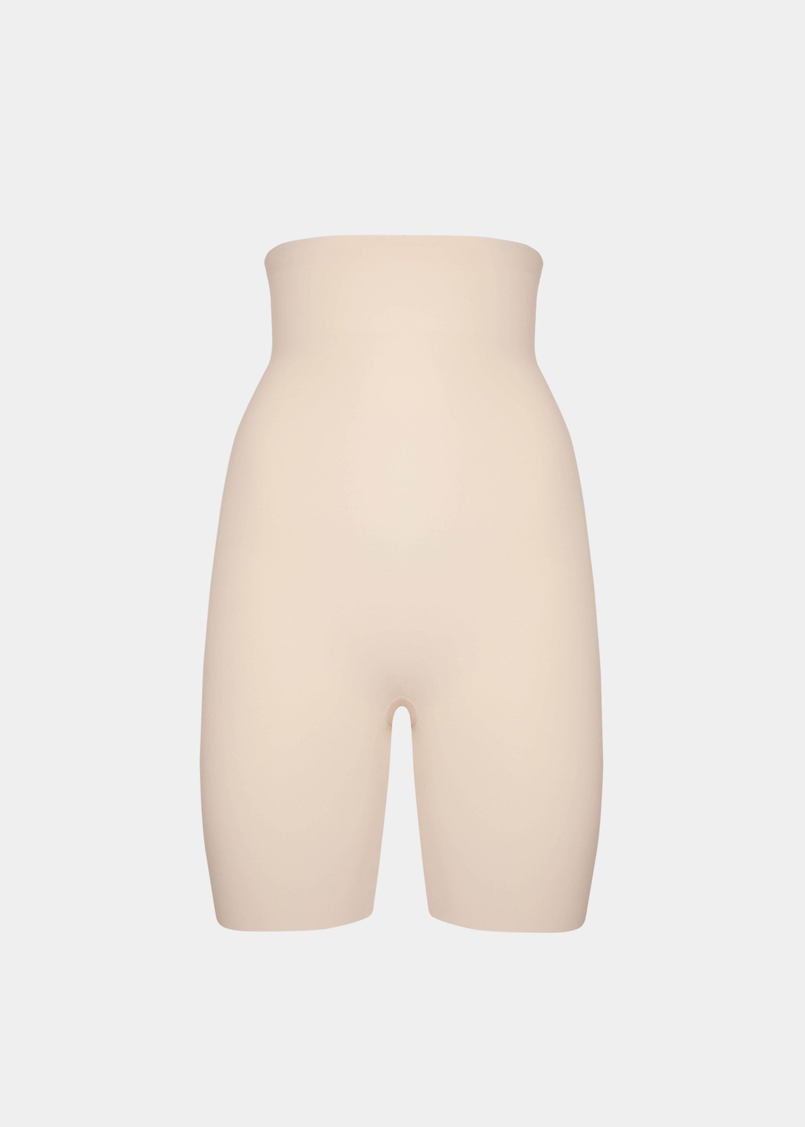 Still product image of Maxi Sexy Hi-Bermuda in latte, high-waist mid-thigh shaping shorts. Smooth powerful fabric providing firm control for tummy, waist, and thighs, with seamless edges and silicone-trimmed waistband visible.