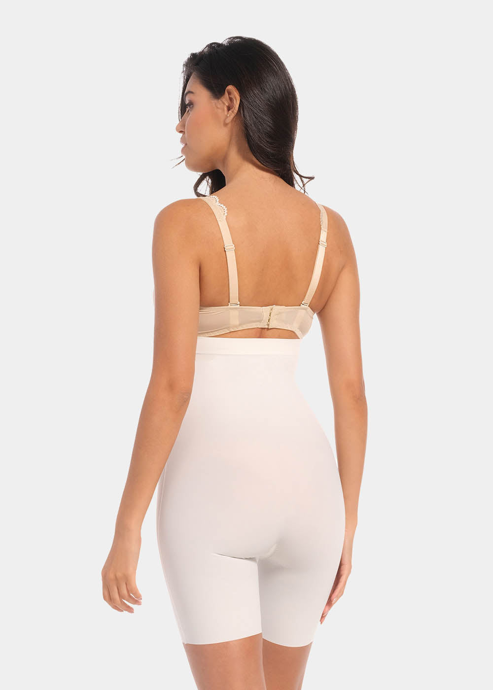Back view of a model wearing Maxi Sexy Hi-Bermuda in barista, high-waist mid-thigh shaping shorts. Smooth powerful fabric with firm control for lower back, hips, and thighs, seamless edges, and silicone-trimmed waistband visible.