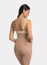 Back view of a model wearing Maxi Sexy Hi-Bermuda in mocha, high-waist mid-thigh shaping shorts. Smooth powerful fabric with firm control for lower back, hips, and thighs, seamless edges, and silicone-trimmed waistband visible.