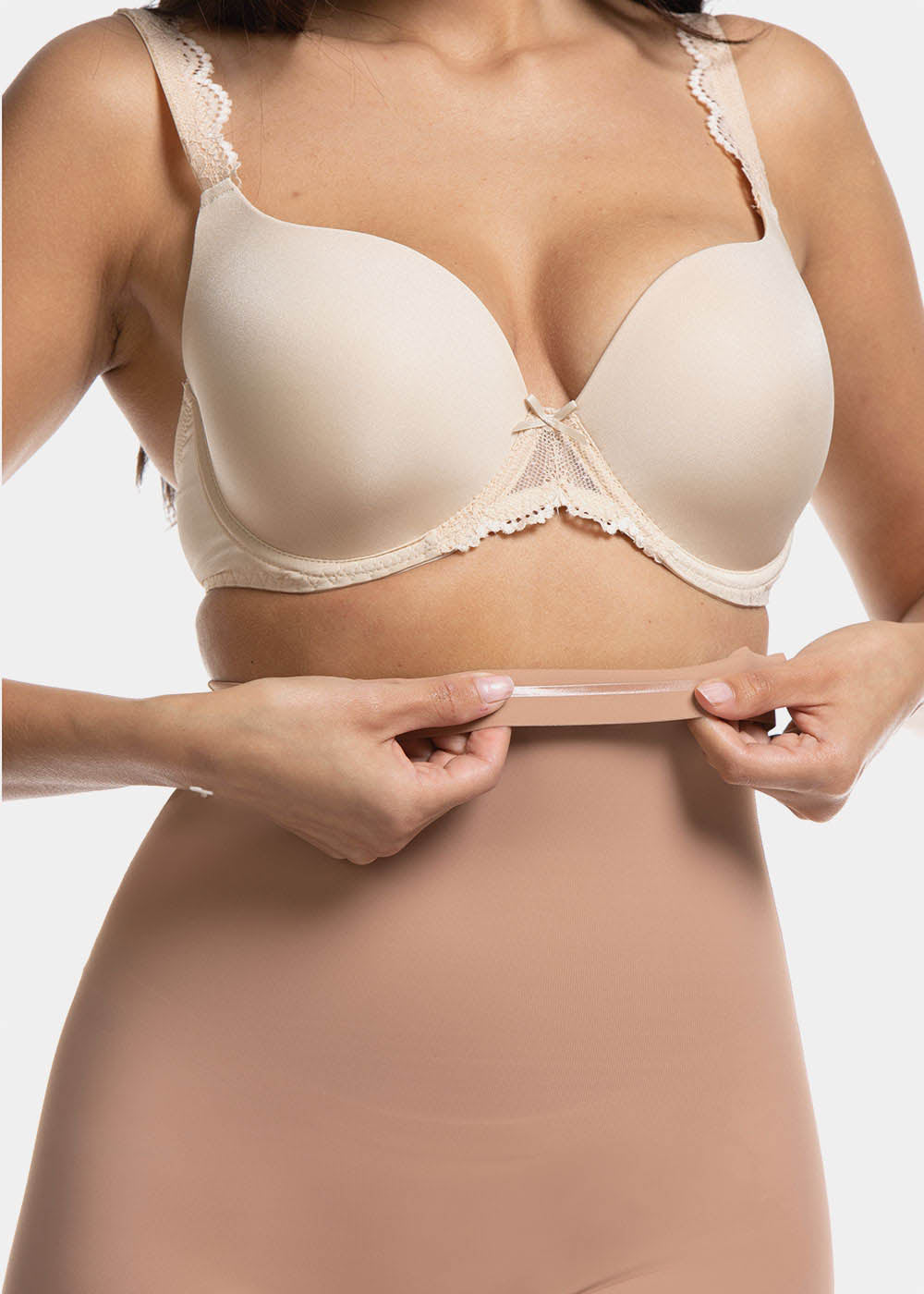 Front view cropped close-up of a model wearing Maxi Sexy Hi-Bermuda in mocha, high-waist mid-thigh shaping shorts. Smooth powerful fabric with silicone-trimmed waistband and seamless edges, showing firm control over tummy, waist, and thighs.
