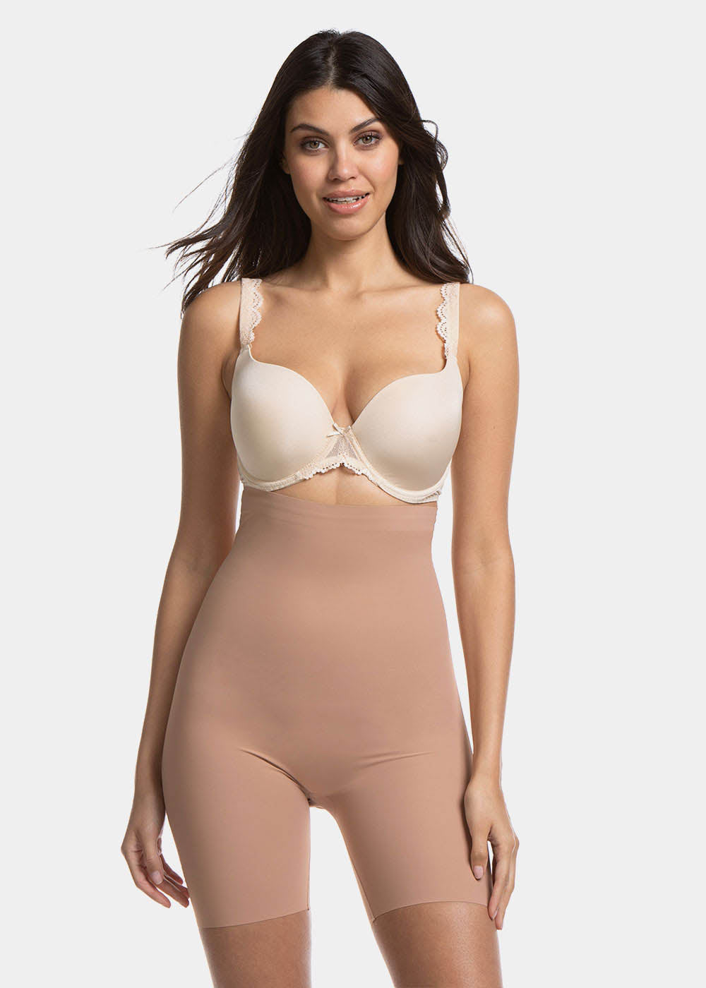 Front view of a model wearing Maxi Sexy Hi-Bermuda in mocha, high-waist mid-thigh shaping shorts. Smooth powerful fabric providing firm control for tummy, waist, and thighs, with seamless edges and silicone-trimmed waistband visible.