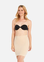 Front view of a model wearing Maxi Sexy Control Skirt in latte, high-waist shaping skirt. Smooth powerful fabric providing firm control for tummy, hips, and thighs, with built-in shaping zone, silicone-trimmed hem, and seamless edges visible.