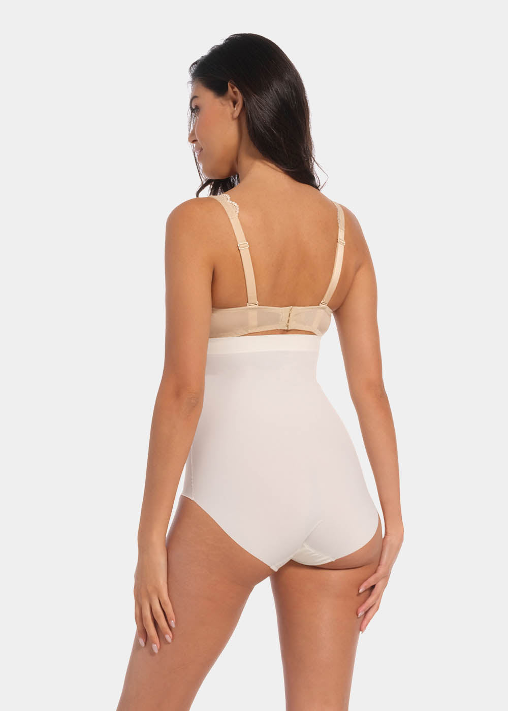 Back view of a model wearing Maxi Sexy Hi-Brief in barista, high-waist shaping brief. Smooth powerful fabric with firm control for lower back and waist, seamless edges, and silicone-trimmed waistband visible.