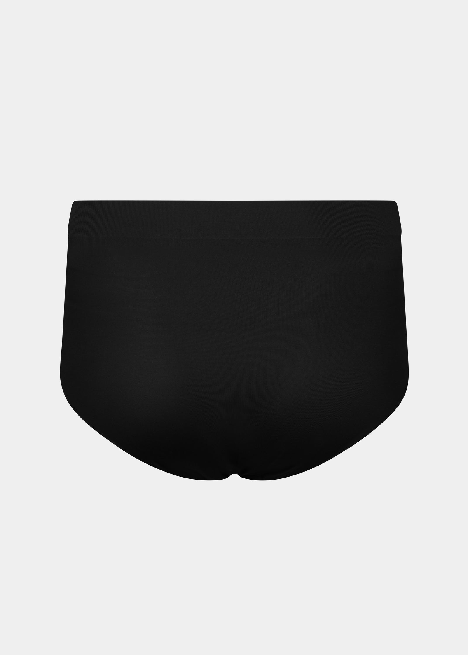 Still product image of Maxi Sexy Shaping Brief in black shown from the back. High-waist shaping brief with smooth strong recycled fabric, firm control for lower back and waist, and seamless edges for invisible wear.
