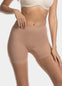 A woman wearing a black maxi sexy short that shapes the lower tummy, hips, and thighs. The short has silicone trim at the leg openings and a seamless edge for an invisible look.
