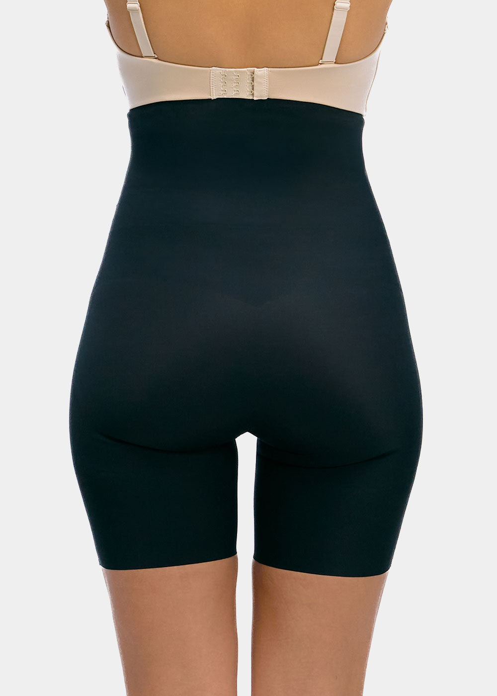 Black shapewear Hi-Bermuda worn over a beige bra on a white background