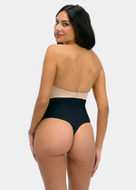 Woman wearing a black thong on a white background