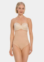 Woman wearing a beige thong on a white background