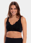 A woman wearing a black Sensual Bra with mesh details at the cups and straps, and a hook-and-eye back closure.