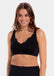 A woman wearing a black Sensual Bra with mesh details at the cups and straps, and a hook-and-eye back closure.