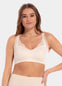 A woman wearing a white Sensual Bra with mesh details at the cups and straps, and a hook-and-eye back closure.