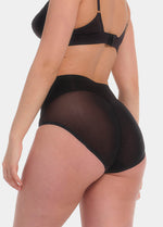 Back view of a model wearing Sheer & Sexy Brief in black, mid-waist shaping brief. Smooth fabric with sheer mesh panels and special lift zone at the buttocks, featuring seamless edges for invisible wear.