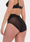Back view of a model wearing Sheer & Sexy Brief in black, mid-waist shaping brief. Smooth fabric with sheer mesh panels and special lift zone at the buttocks, featuring seamless edges for invisible wear.