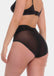 Back view of a model wearing Sheer & Sexy Brief in black, mid-waist shaping brief. Smooth fabric with sheer mesh panels and special lift zone at the buttocks, featuring seamless edges for invisible wear.