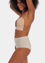 Person wearing a cappuccino strapless LUve Bra with a plain background. 