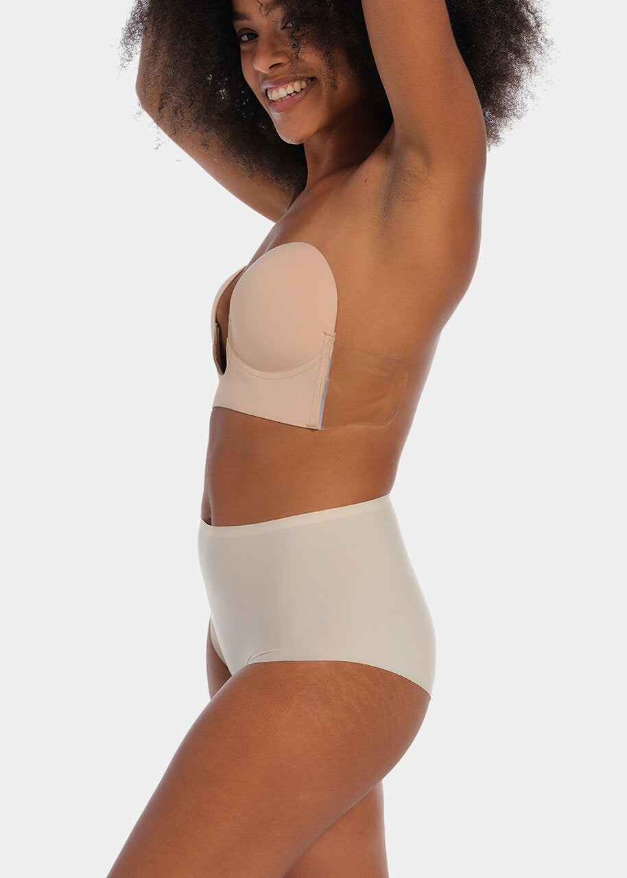 Person wearing a cappuccino strapless LUve Bra with a plain background. 