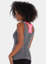 A woman wearing the Active Bra Top and showing the backside of the product