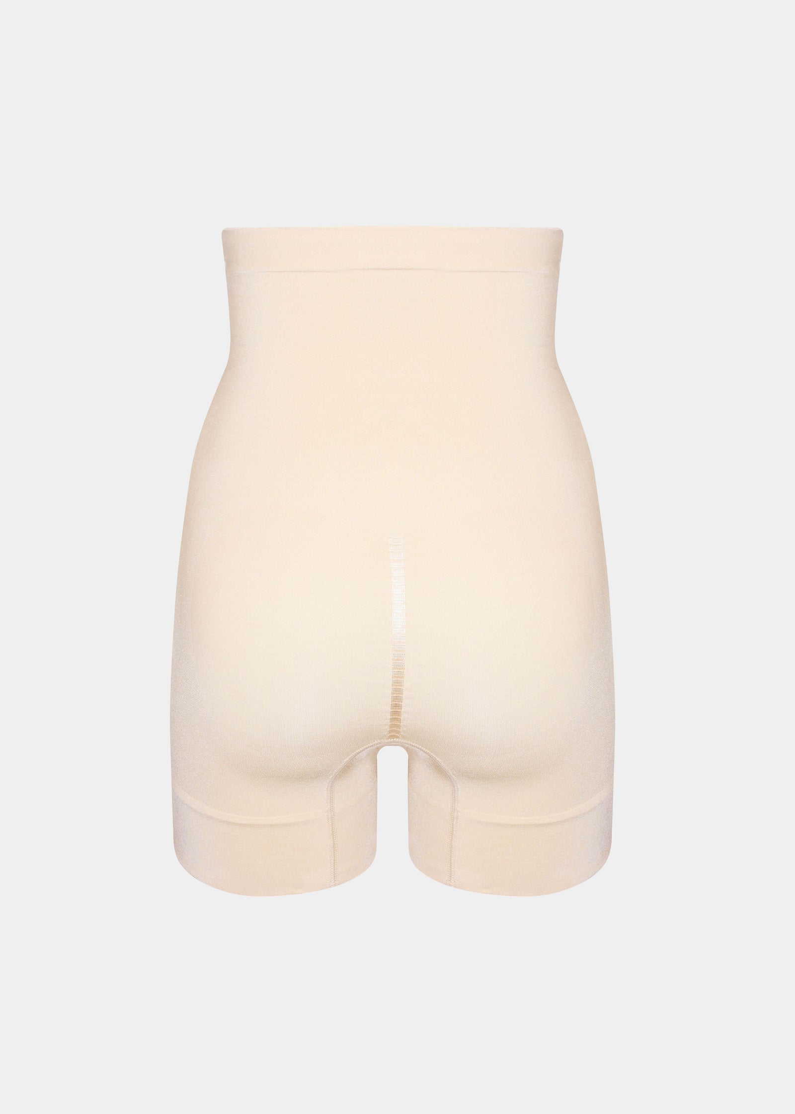 Still product image of Comfort Shaper in latte shown from the back. High-waist seamless shaping shorts with smooth stretchable fabric, medium shaping for back and hips, silicone trim at waistband and leg openings, and power zone to lift the bottom.