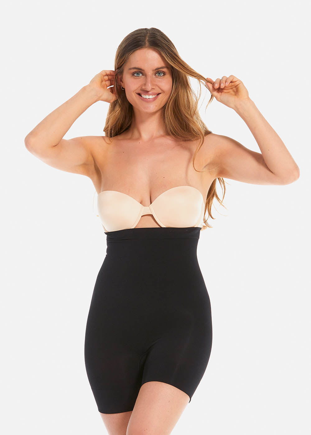 Front view of a model wearing Comfort Shaper in black, high-waist seamless shaping shorts. Stretchable fabric providing medium shaping for abdomen, waist, back, and thighs, with silicone-trimmed waistband and leg openings and a reinforced lift zone for the bottom.