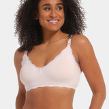 Front view of a model wearing Mama Lace Bralette in rose, seamless wire-free nursing bra. Stretch fabric cups with removable pads, clip-down cups for nursing, adjustable straps, and lace trim along the edges visible.