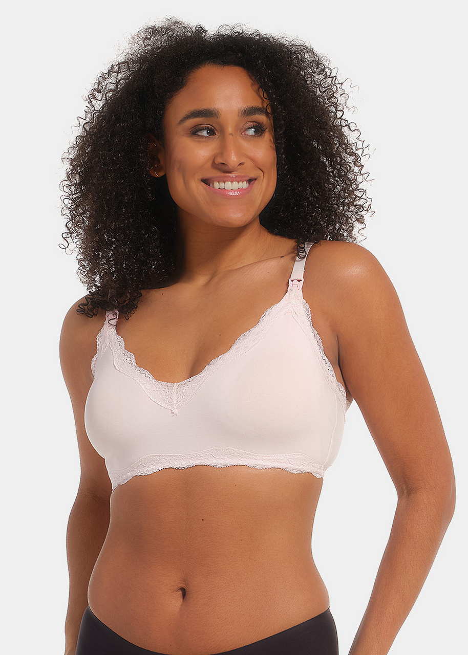 Front view of a model wearing Mama Lace Bralette in rose, seamless wire-free nursing bra. Stretch fabric cups with removable pads, clip-down cups for nursing, adjustable straps, and lace trim along the edges visible.