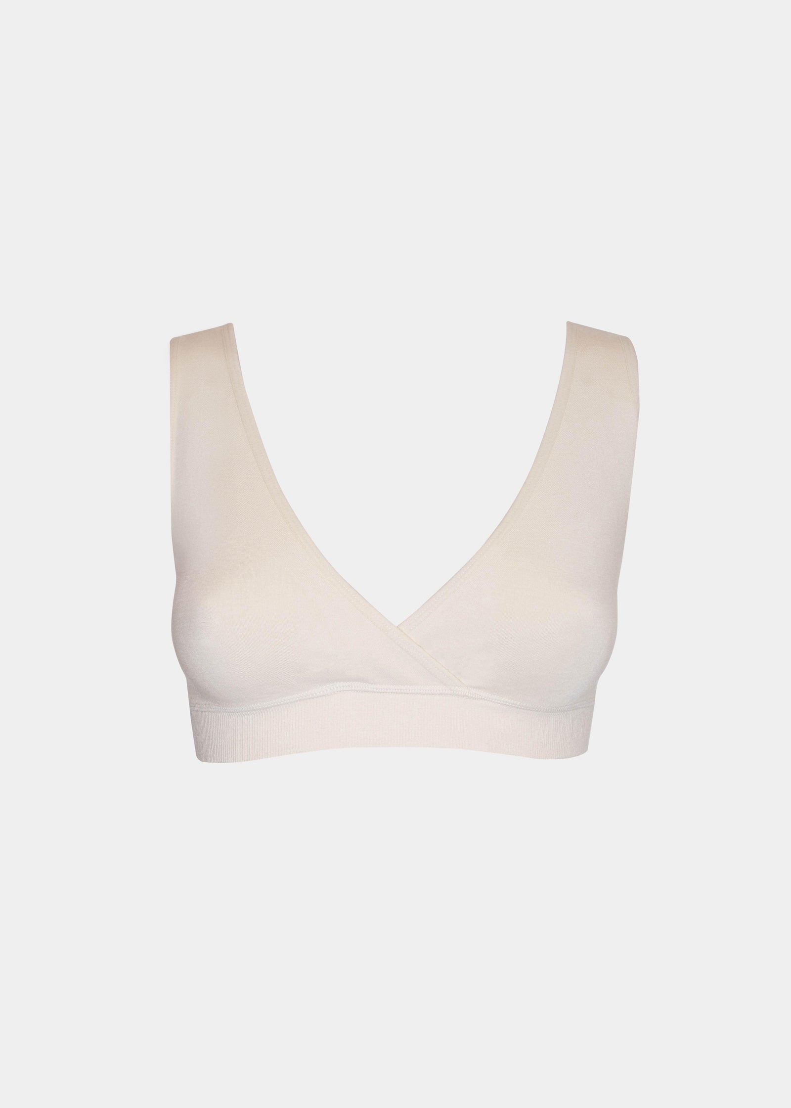 Still product image of Bamboo Soft Bra in cream, seamless wire-free bra made with bamboo fibers. Cross-front V-neck, supportive underbust band, and smooth fabric front visible for comfortable and invisible wear.