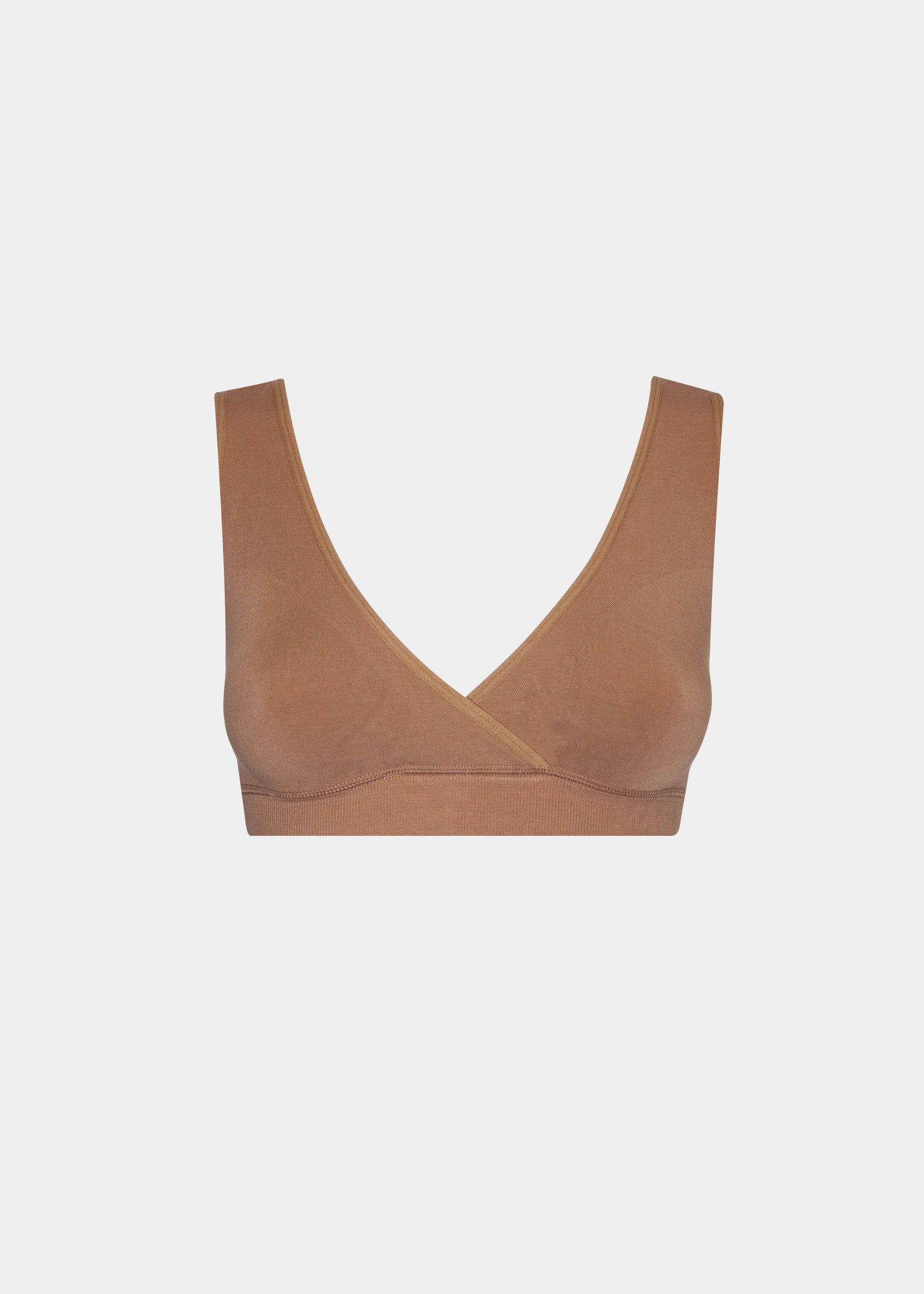 Still product image of Bamboo Soft Bra in mocha, seamless wire-free bra made with bamboo fibers. Cross-front V-neck, supportive underbust band, wider straps, and smooth back visible for comfort and invisible wear.
