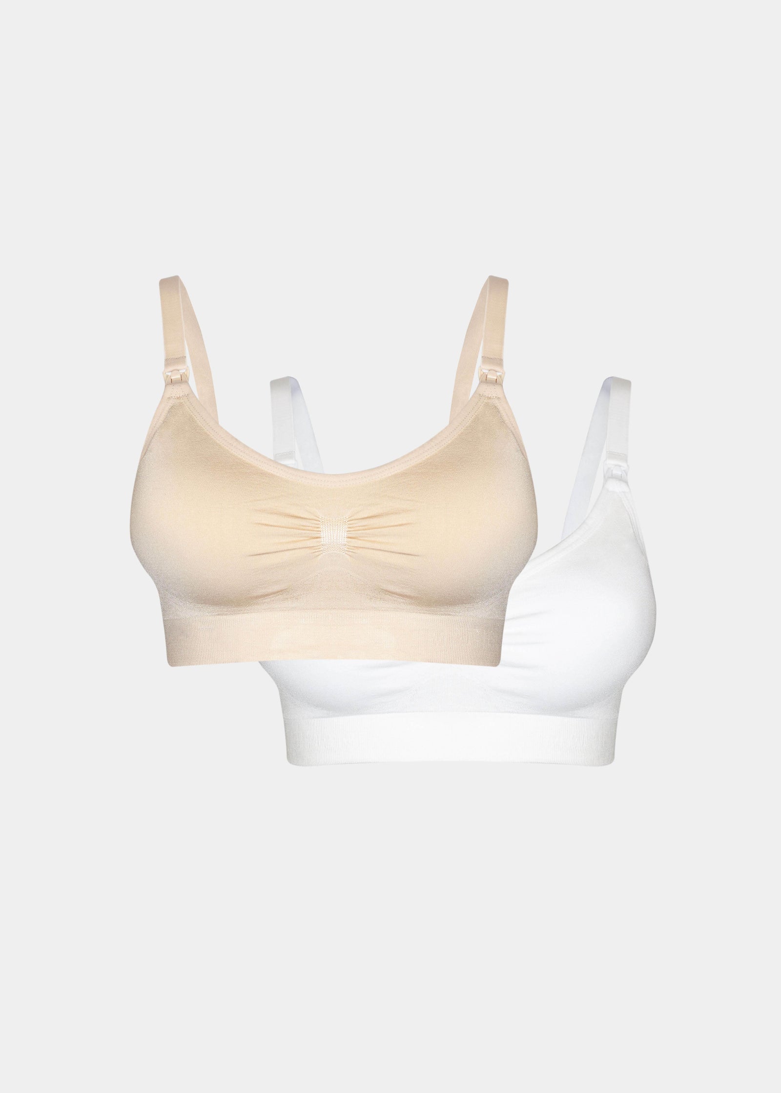 Still product image of Mama Comfort Nursing Bra in latte and white, seamless wire-free nursing bras. Two bras shown flat with adjustable straps, clip-down cups, and smooth stretchable fabric visible.