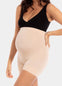 Front view of a model wearing Mama Supporting Short in latte, over-the-bump seamless maternity shapewear shorts. Smooth stretchable fabric with full belly panel and mid-thigh length, designed for support and invisible wear under clothing.