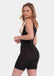 Side view of a model wearing the Seamless Bodysuit in a wear-your-own-bra style, featuring comfortable seamless fabric with medium shaping through the tummy, waist, back, and upper thighs. The design includes subtle lift zones at the bust and bottom, a smooth invisible finish, and a flattering sculpted fit.