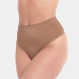 Front view of a model wearing the Macchiato Comfort Thong, showcasing the soft, seamless fabric with light shaping through the lower tummy and a smooth, invisible finish under clothing.