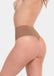Back view of a model wearing the Macchiato-colored Comfort Thong, featuring soft, seamless fabric with a smooth, minimal design and an invisible finish that enhances the natural shape.