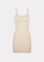 Still product image of Seamless Bodydress in latte, body-contouring shaping dress. Smooth seamless fabric providing medium shaping for tummy, waist, hips, and back, with adjustable spaghetti straps, no bust shaping, and silicone-trimmed hem visible.
