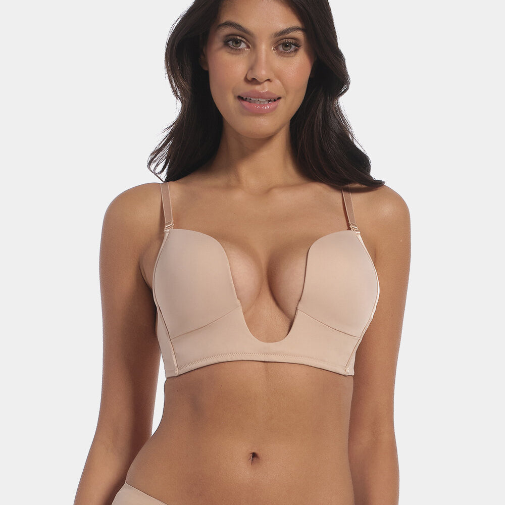 This image features a model wearing a V-Bra, which is designed to be nearly invisible under clothing with low plunge necklines. The bra boasts a deep cleavage front and an extra low back, making it ideal for seamless coverage.