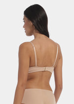 This image features a model wearing a V-Bra, which is designed to be nearly invisible under clothing with low plunge necklines. The bra boasts a deep cleavage front and an extra low back, making it ideal for seamless coverage.