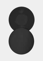 Still product image of the black MAGIC Hide Your Nipples covers, showcasing the soft fabric nipple covers with a smooth outer surface and inner adhesive layer for discreet, invisible coverage.