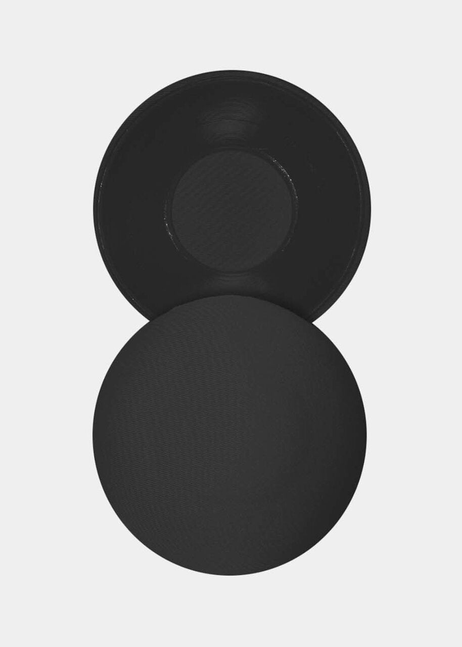 Still product image of the black MAGIC Hide Your Nipples covers, showcasing the soft fabric nipple covers with a smooth outer surface and inner adhesive layer for discreet, invisible coverage.