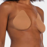 Front view of a model wearing the mocha-colored Beverly Hills Secret breast lift tapes, showcasing the ultra-thin adhesive tapes that lift and support the bust while creating a smooth, invisible look under clothing.