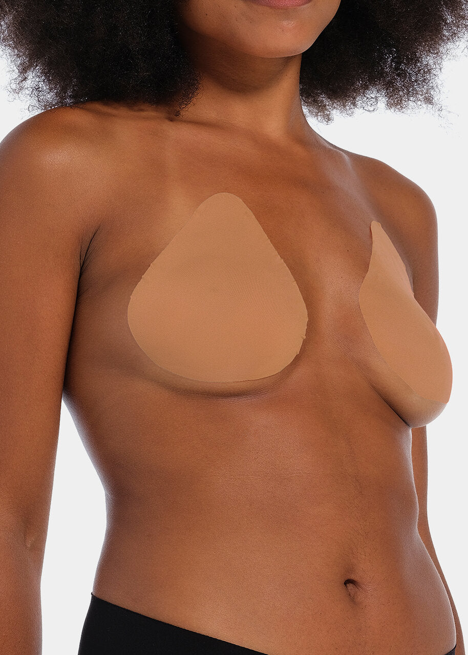 Front view of a model wearing the mocha-colored Beverly Hills Secret breast lift tapes, showcasing the ultra-thin adhesive tapes that lift and support the bust while creating a smooth, invisible look under clothing.