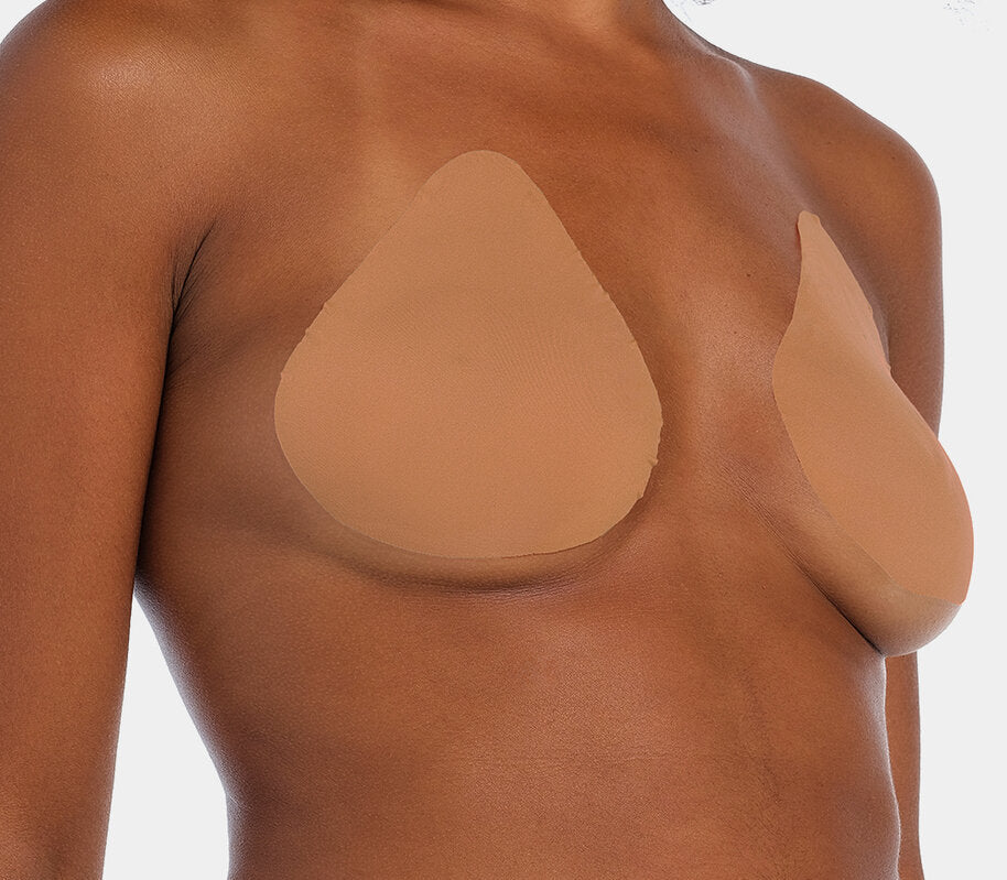 Front view of a model wearing the mocha-colored Beverly Hills Secret breast lift tapes, showcasing the ultra-thin adhesive tapes that lift and support the bust while creating a smooth, invisible look under clothing.