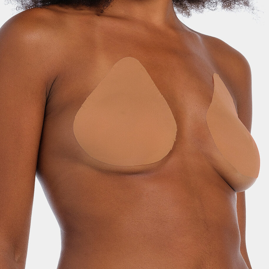 Front view of a model wearing the mocha-colored Beverly Hills Secret breast lift tapes, showcasing the ultra-thin adhesive tapes that lift and support the bust while creating a smooth, invisible look under clothing.