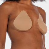 Front view of a model wearing the caramel-colored Beverly Hills Secret breast lift tapes, showcasing the ultra-thin adhesive tapes that lift and support the bust while creating a smooth, invisible look under clothing.