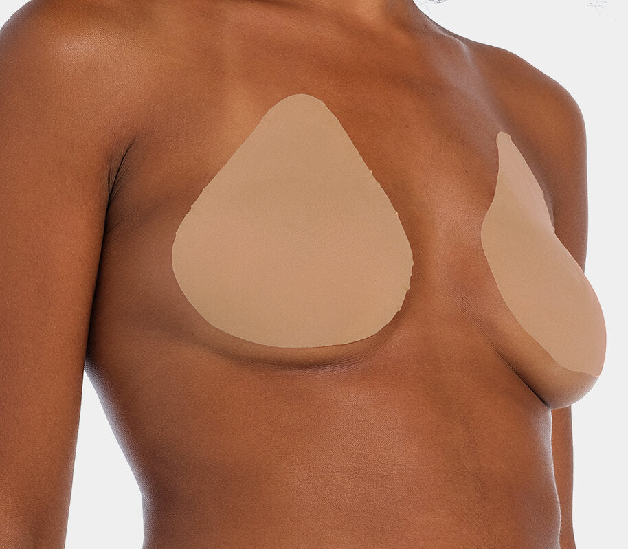 Front view of a model wearing the caramel-colored Beverly Hills Secret breast lift tapes, showcasing the ultra-thin adhesive tapes that lift and support the bust while creating a smooth, invisible look under clothing.