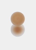 Still product image of the caramel-colored MAGIC Nipples silicone nipple covers, showcasing the ultra-thin, soft covers designed for discreet, invisible coverage without adhesive.