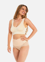 Front view of a model wearing Tummy Shaper Lace in latte, mid-waist shaping brief with lace detailing. Smooth fabric front, double-layer waistband, and lace edges designed for shaping and invisible wear under clothing.